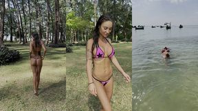 monika fox poses in pink bikini with stars on beach
