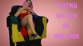 Lady Angela Your domme girlfriend is taking selfies in one shoe skneel in front of your fetish goddess and worship her soles – dangling red bottom heels