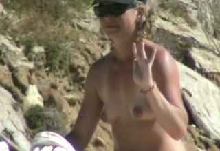 Amateur white lady sitting on the rocks spied with camera