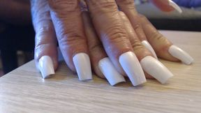 Tapping clicking white fingernails