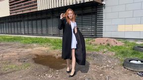 A girl in high-heeled shoes crushing them in mud and muddy puddles
