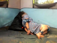 Susie hogtied on the tent floor