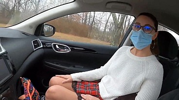 Teen girl in plaid skirt gets a ride to school from a stranger on a snowy day