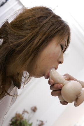 Ayumi Haruna sucking on a rubber cock and the real thing