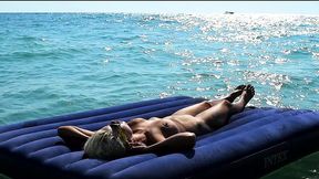 I witnessed slow-mo shots of a naked babe flaunting her ample bosom on sandy shores, lounging on a sumptuous mat