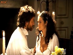 Manuela Arcuri first shows awesome cleavage in low cut