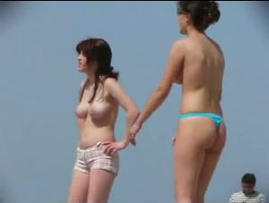 Filming sexy European girls playing volleyball topless on a public beach