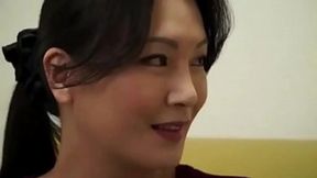 Busty Asian mom enjoys younger men's rods