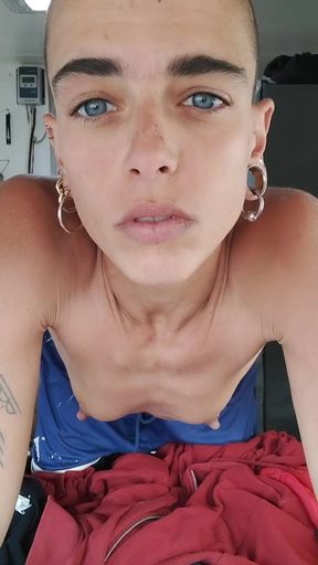 Androgynous teen with blue eyes uses vibrator on her bush