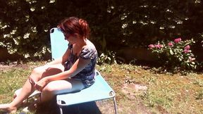 italian girl sunbathing in a public garden with a big dirty diaper