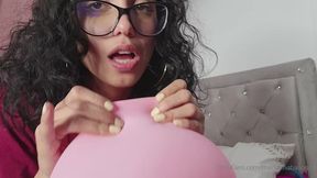 Marianna bites and bursts her balloons