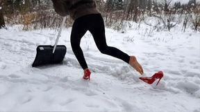 cleans snow with a shovel in louboutin, louboutin hot chick in winter forest, high heels in snow
