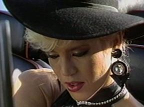 Hot stuff Amber Lynn shows up in sexy black lingerie and stockings