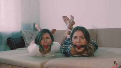 Dusya and Maya hogtied together