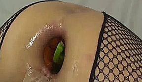Spicy chili peppers stretch her gaping asshole
