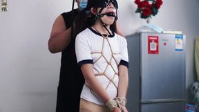 East Meets Leather: Bound Brunette Endures the Cane