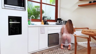 A sexy petite brunette Amy Haze cleaning on kitchen in a transparent dress without underwear