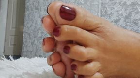Angelin spreading her toes and tasting with her well-painted toenails (1)