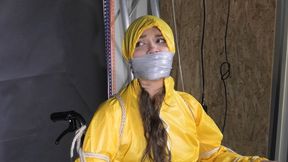 Watch Marie bound to a Wheelchair and tightly gagged in shiny nylon Rainwear
