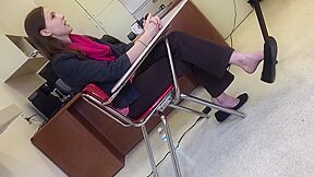 Office Lady Captured Dangling Her Shoe While Sitting On The Desk