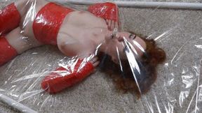 Red stretch film bondage in a vacuum bed