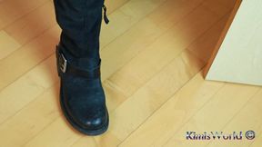 Rugged Elegance – Worn Tights & Biker Boots in a Black Minidress