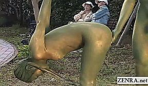 Subtitled Japanese woman painted to mimic park statue