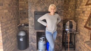Desperate blonde needs to piss so she stood outdoor on the porch and pissed into her blue jeans