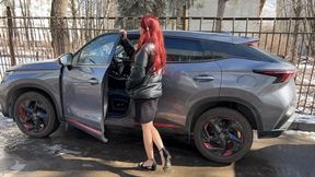 A girl in sandals likes to play with the car and the pedals of the car, with and without sandals