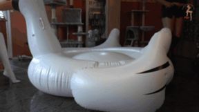 Big inflatable Swan under two pair of Boots