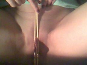 Squeezing my clit and loose pussy lips with china-sticks