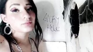 Hispanic deepthroats gigantic penis through gloryhole