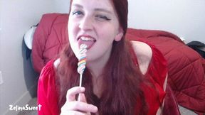 Licking a lollipop