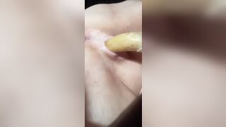 Banana w/ condom into it, squirting inside the end!