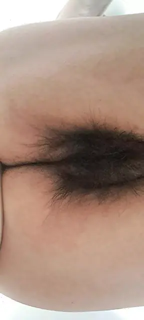 Mature milf's fat, open, hairy pussy seen from below