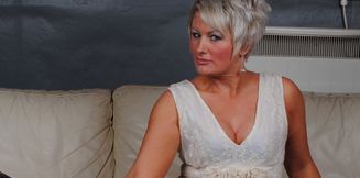 Classy British MILF Sally Cream strips naked and masturbates her shaved mature pussy