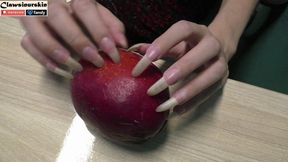 I destroy fruit by piercing, digging and scratching with my long natural nails