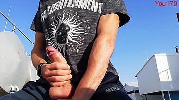 you want to watch this guy jerk off his big dick and bring himself to orgasm in a public place