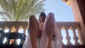 Hairy pussy on the outdoor balcony masturbates and orgasms with squirting