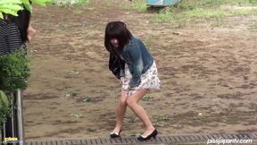 Asia&#039;s Little Brunette Let&#039;s Her Pants Get Wet Outdoors