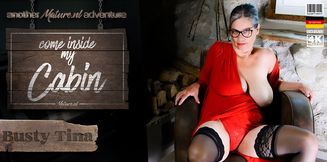 Big breasted hairy grandma Busty Tina invites you to her cabin and have fun