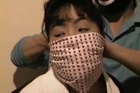 Stuffed and Silenced: Asian Brunette&#039;s Gag-Filled Torture
