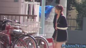 Busty Brunette Bladders on Japanese Street