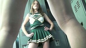 Cute cheerleader kicks dude in his balls in a locker room