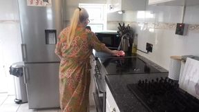 Naughty housewife cleaning in the kitchen