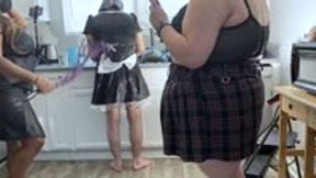 slave dressed as maid unicorn doess dishes while goddess and her minion have fun