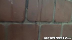 Shameless Asian babe spied on while peeing outdoors