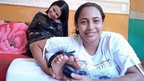 Eli looks for delicious tickles on Gilbelys shy feet