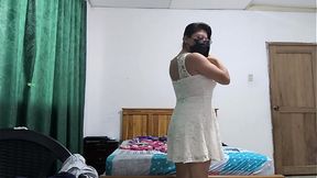 The busty executive chooses a white dress and then starts making sensual movements, showing her beautiful vagina