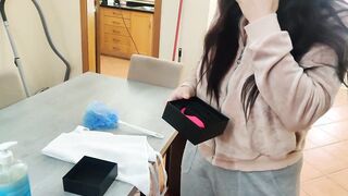 Maid with glasses using a booty plug and remote sex toy